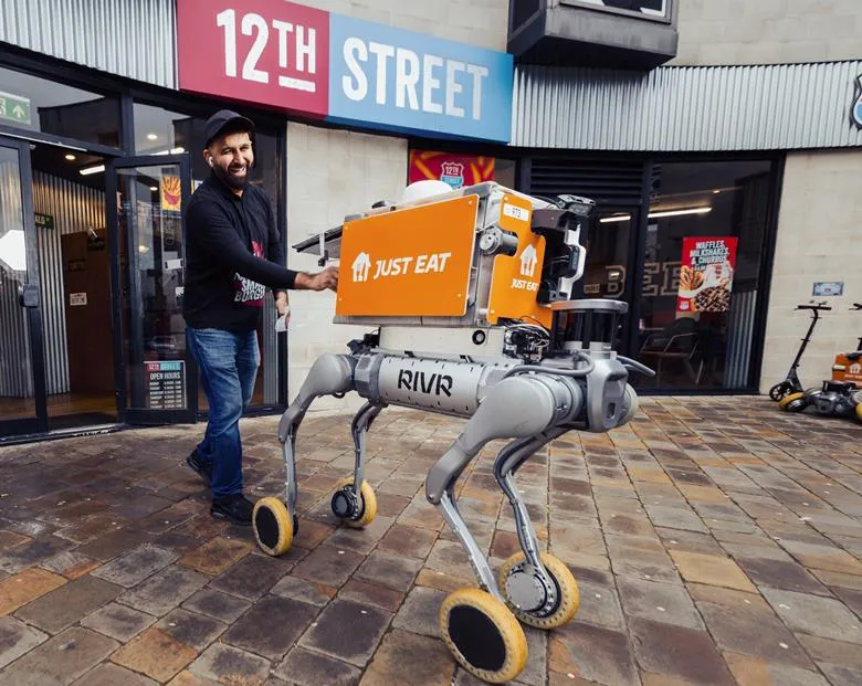A Just Eat autonomous delivery robot navigating a public footpath in Milton Keynes